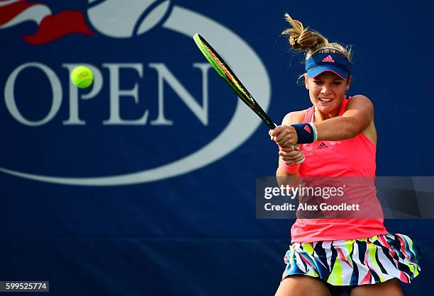 Caty McNally of the United States returns a shot to Bianca Andreescu of Canada during her first round Junior Girl's match on Day Eight of the 2016 US...