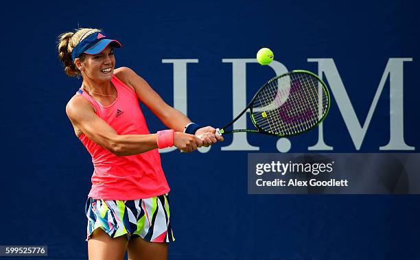 Caty McNally of the United States returns a shot to Bianca Andreescu of Canada during her first round Junior Girl's match on Day Eight of the 2016 US...