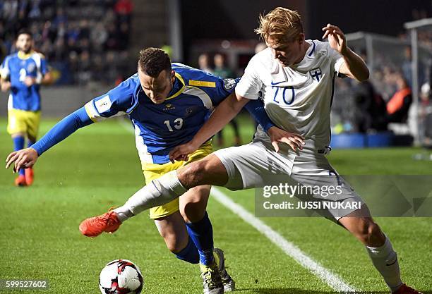 Joel Pohjanpalo of Finland vies with Albert Bunjaku of Kosovo during the World Cup 2018 qualifying football match Finland vs Kosovo on September 5,...