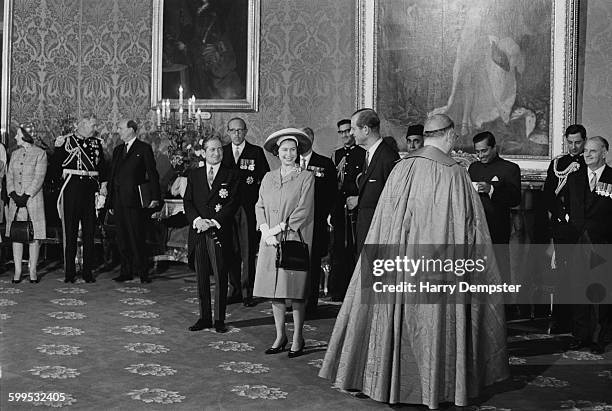 Queen Elizabeth II and Prince Philip, the Duke of Edinburgh, arrive in Malta for a Commonwealth visit, 14th November 1967. They are met by Maltese...