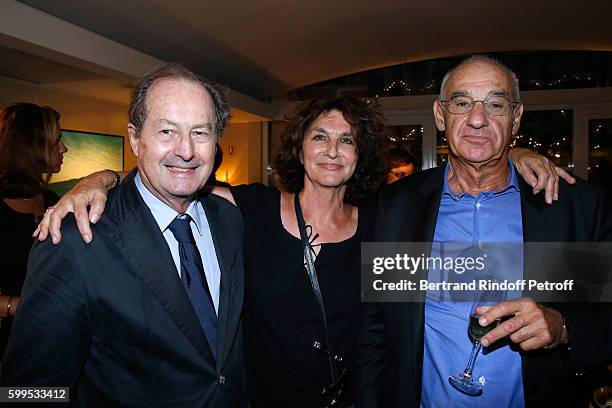 Producer Fabienne Servan-Schreiber standing between her husband Henri Weber and Member of French Academy, Jean-Marie Rouart attend the "Cezanne et...