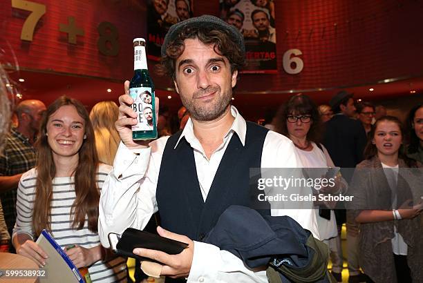 Oliver Wnuk with a Babo blue beer during the premiere for the film 'Maennertag' at Mathaeser Filmpalast on September 5, 2016 in Munich, Germany.