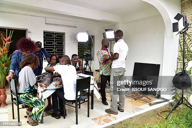 Ivorian actress, director and show creator Akissi Delta stands at a film set during the shooting of the television series 'Ma Famille' in Abidjan on...