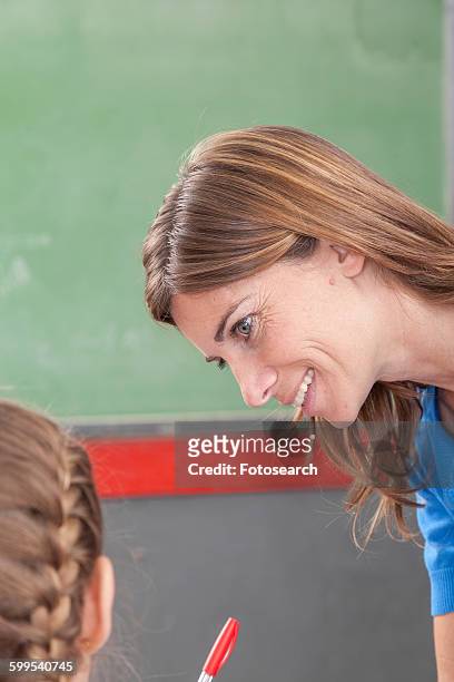 teacher checking the homework - junior girl models stock pictures, royalty-free photos & images