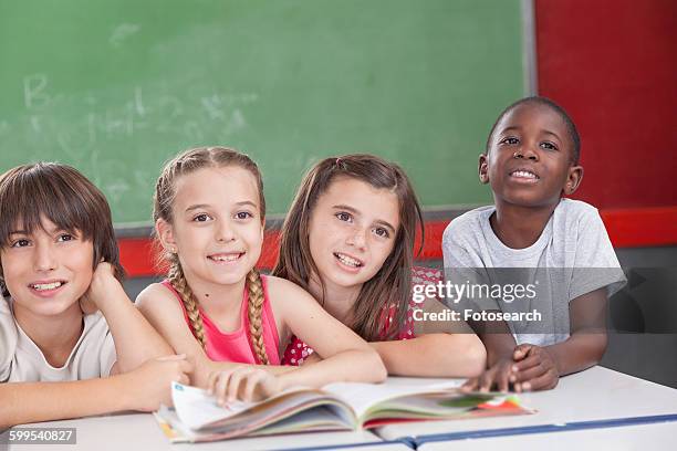 pupils looking at the teacher - junior girl models stock pictures, royalty-free photos & images