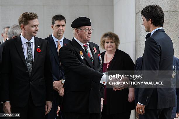 Canadian Prime Minister Justin Trudeau meets well-wishers at the Sai Wan War Cemetery before laying a wreath during his visit to Hong Kong on...