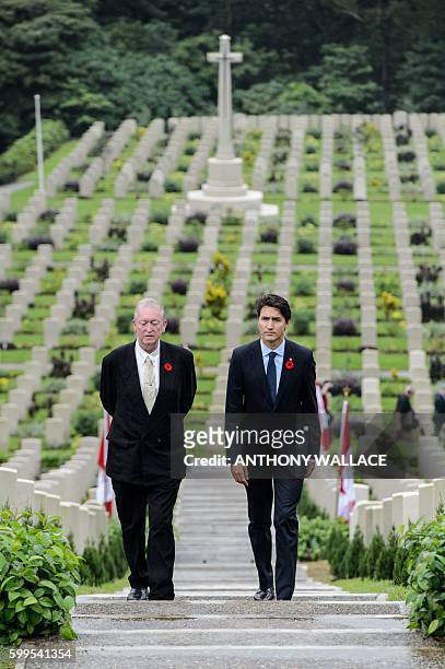 Canadian Prime Minister Justin Trudeau walks with British historian Tony Banham through the Sai Wan War Cemetery during his visit to Hong Kong on...