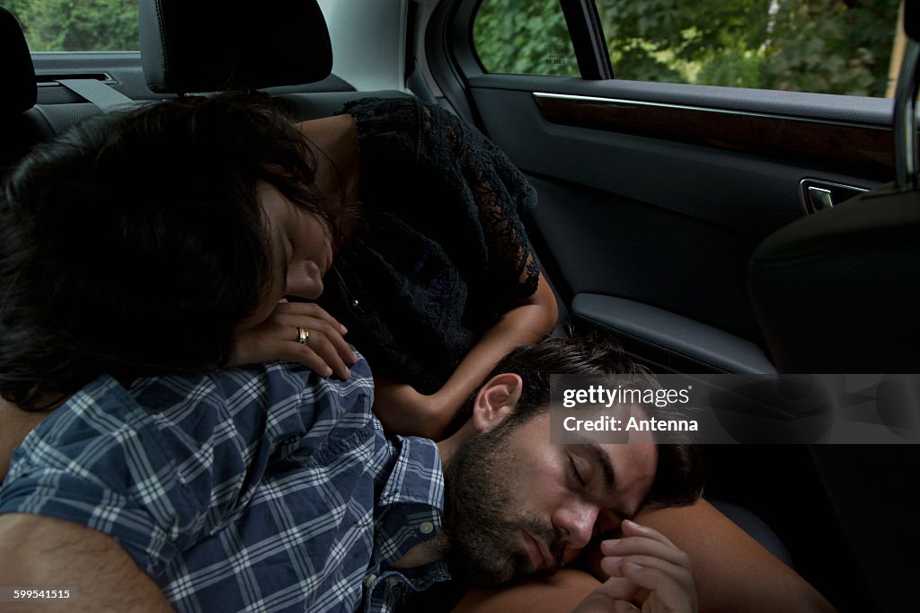 Young couple relaxing in car