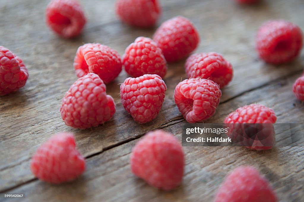 Raspberries on wooden table