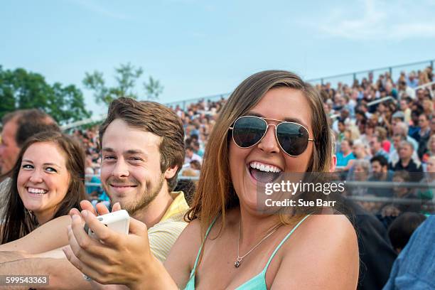 young man and sisters at graduation ceremony - sue clapper imagens e fotografias de stock