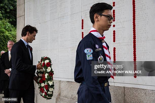 Canadian Prime Minister Justin Trudeau lays a wreath at the Sai Wan War Cemetery during his visit to Hong Kong on September 6, 2016. Trudeau is here...