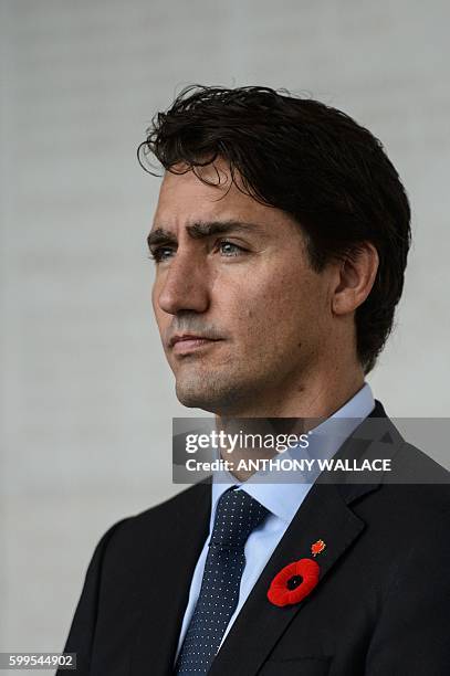 Canadian Prime Minister Justin Trudeau pauses after laying a wreath at the Sai Wan War Cemetery during his visit to Hong Kong on September 6, 2016....