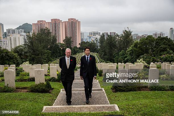 Canadian Prime Minister Justin Trudeau walks through the Sai Wan War Cemetery with British historian Tony Banham during his visit to Hong Kong on...