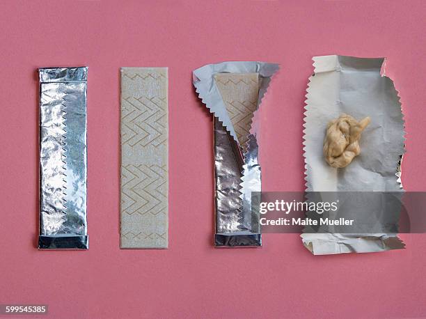 progressive stages of bubble gum being chewed against pink background - sticking up stock pictures, royalty-free photos & images