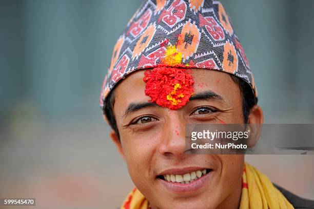 Priest smiles as offering ritual prayer at Rishishwor Mahadev Temple during Rishi Panchami Festival celebrations at Teku, Katmandu, Nepal on Tuesday...