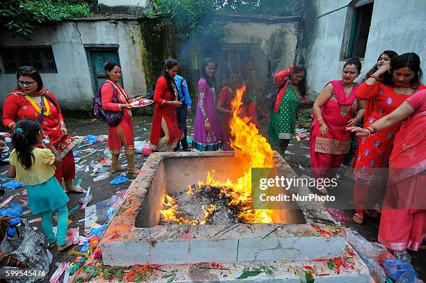 Nepalese Hindu devotees offering oil and butter lamps at the Rishishwor Mahadev Temple during Rishi Panchami Festival celebrations at Teku, Katmandu,...