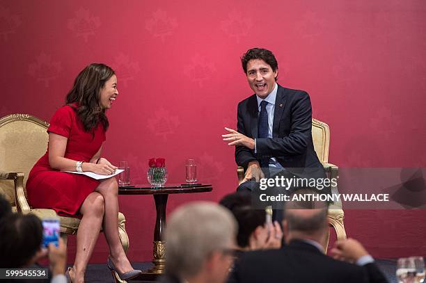 Canadian Prime Minister Justin Trudeau answers a question from Bloomberg Television anchor Angie Lau during a Canada-Hong Kong business luncheon,...