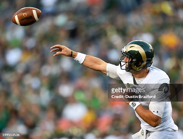 Quarterback Nick Stevens of the Colorado State Rams passes against the Colorado Buffaloes during a game at Sports Authority Field at Mile High on...