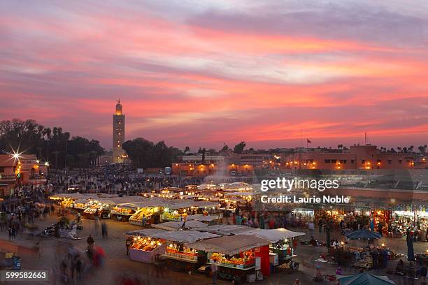 sunset, jemma el fna, marrakesh, morocco - marrakesh stock pictures, royalty-free photos & images