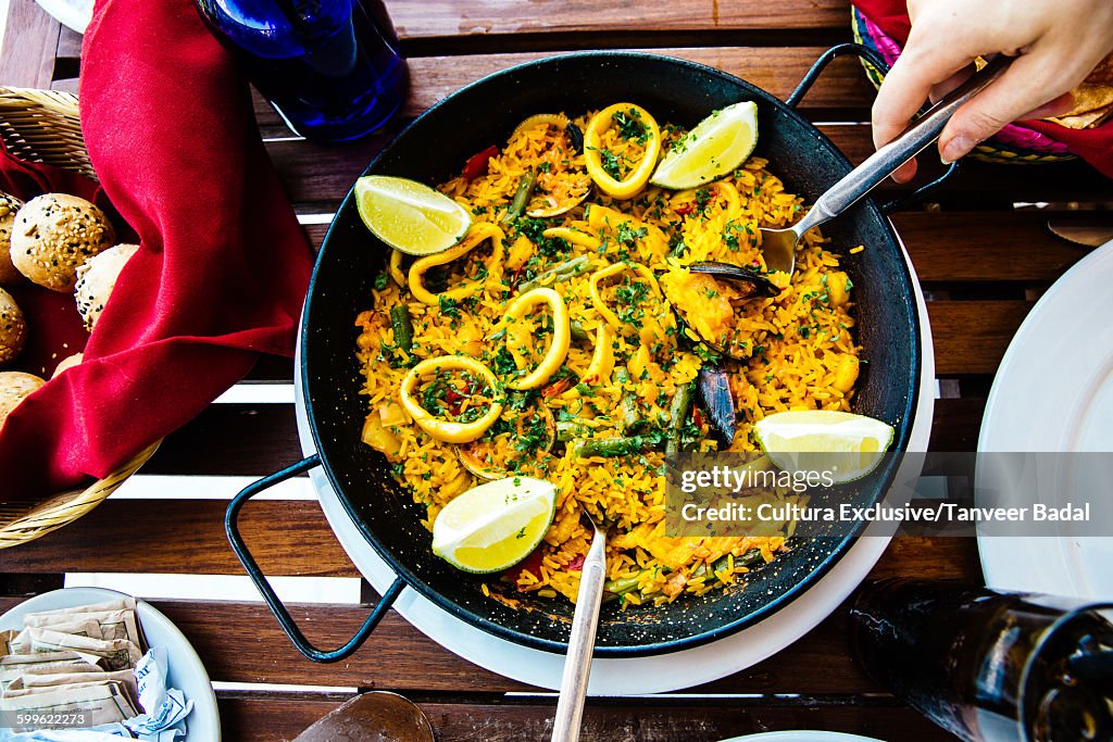 Overhead view of paella at restaurant table, Tulum, Riviera Maya, Mexico