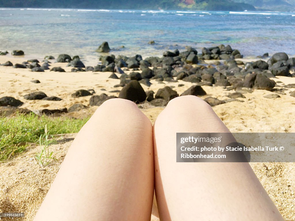 POV knees on beach