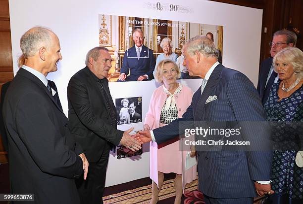 Prince Charles, Prince of Wales and Camilla, Duchess of Cornwall meets long serving postal workers as they attend a reception to mark the 500th...