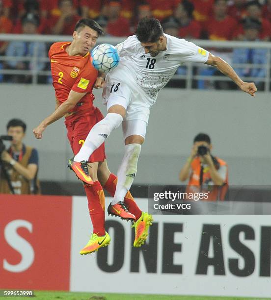 Ren Hang of China and Alireza Jahan Bakhsh of Iran compete for the ball during the 2018 Russia World Cup Asia Qualifiers match between China and Iran...