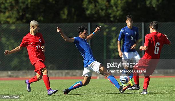 Riccardo Marchizza of Italy competes for the ball with Abdulkadir Omur and Mete Demir of Turkey during the international friendly match between Italy...