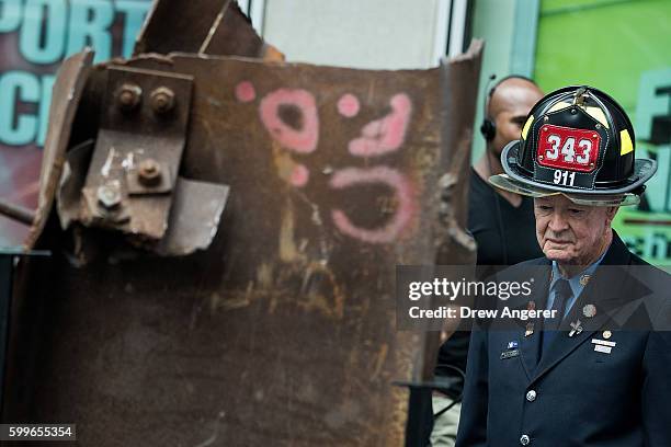 Bob Beckwith, retired firefighter who stood next to President George W. Bush at ground zero, stands next to a piece of steel from the World Trade...