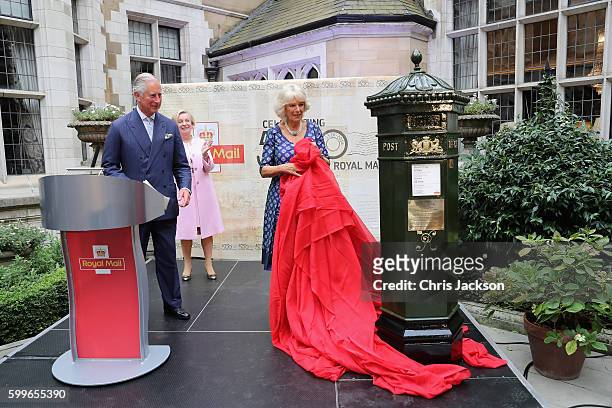 Prince Charles, Prince of Wales and Camilla, Duchess of Cornwall unveil a penfold postbox as they attend a reception to mark the 500th Anniversary of...
