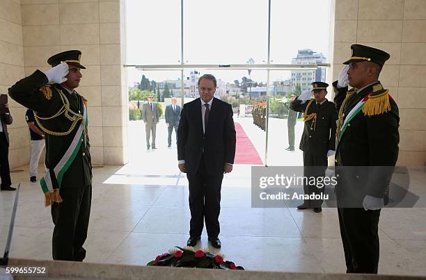 Russian President Vladimir Putins Special Envoy for the Middle East Mikhail Bogdanov stands in silence after he lays a wreath at the Mausoleum of...