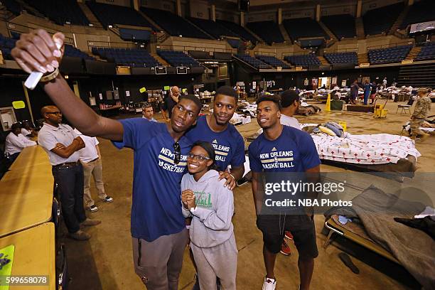 Cheick Diallo, Terrence Jones and Buddy Hield of the New Orleans Pelicans participate in a community outreach initiative which had players spend time...