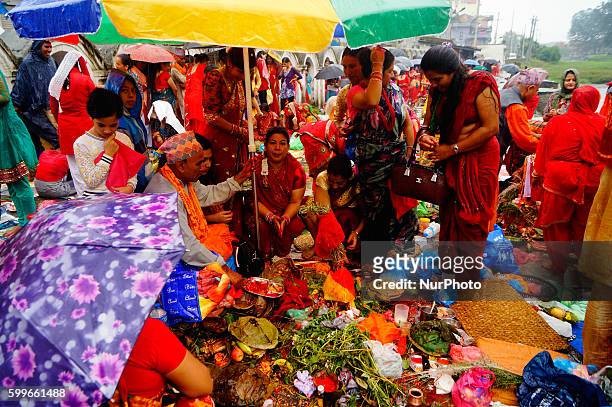 Nepalese Hindu women perform ritual at the bank of Bagmati River during the Rishi Panchami festival in Kathmandu, Nepal, September 6, 2016. Rishi...