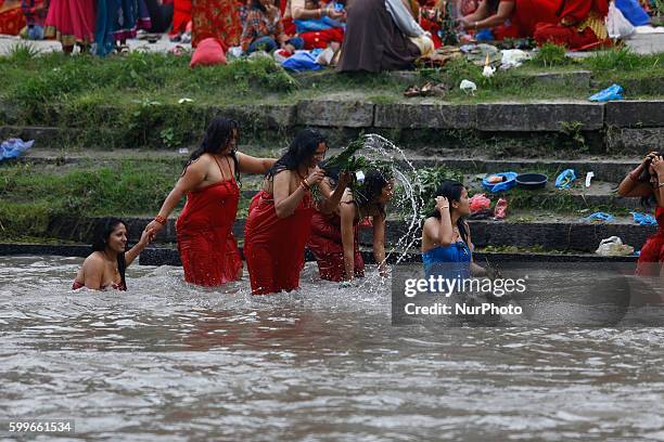 Nepalese Hindu women perform ritual bath in the Bagmati River during the Rishi Panchami festival in Kathmandu, Nepal, September 6, 2016. Rishi...