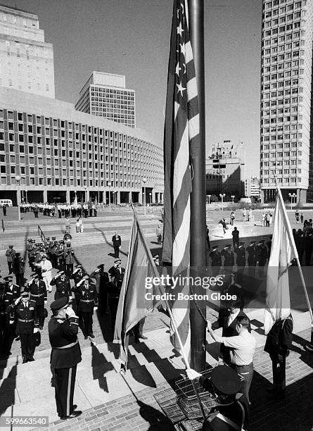 Deputy Mayor Edward T. Sullivan raises the American Flag in City Hall Plaza in Boston on July 4, 1971.