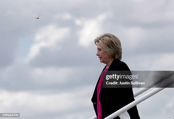 Democratic presidential nominee former Secretary of State Hillary Clinton walks off of her campaign plane at Tampa International Airport on September...