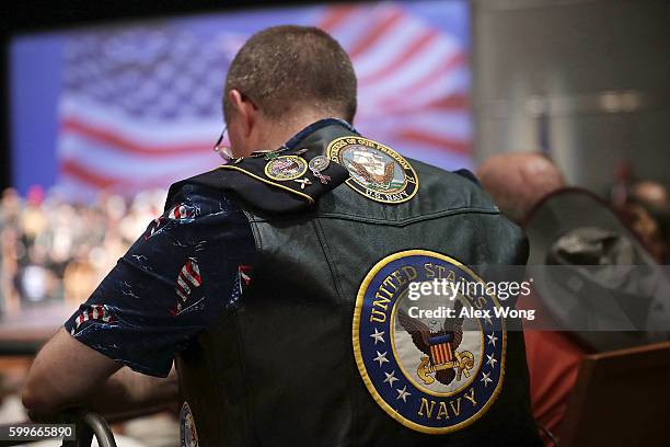 Navy veteran participates in an opening prayer during a campaign event for Republican presidential nominee Donald Trump September 6, 2016 in Virginia...