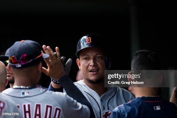 Closeup of Detroit Tigers Miguel Cabrera victorious in dugout with teammates during game vs Texas Rangers at Globe Life Park in Arlington. Arlington,...