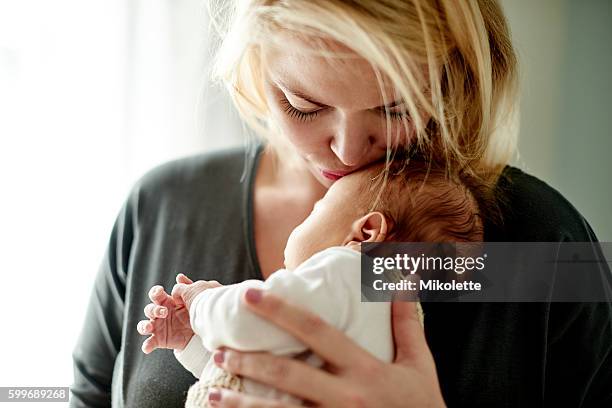 i never thought i could love one being so much - mom holding baby stock pictures, royalty-free photos & images