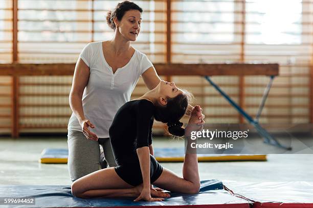 girl practicing gymnastics. - floor gymnastics stock pictures, royalty-free photos & images