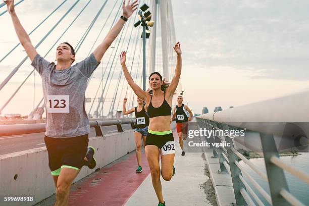 marathon runners. - finishing stock pictures, royalty-free photos & images