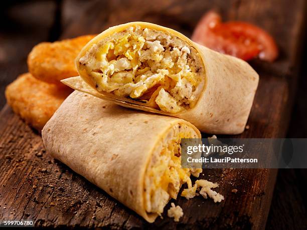 scrambled egg and cheese breakfast wrap - wrap sandwich stock pictures, royalty-free photos & images