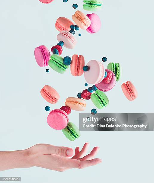 sweets for a stage magician: flying macarons - macarons fotografías e imágenes de stock