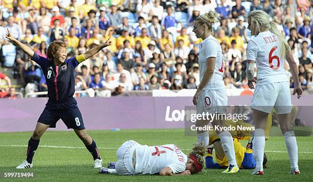 England - Japan's captain Aya Miyama celebrates after scoring by heading home during the first half of an Olympic women's soccer Group F opener...