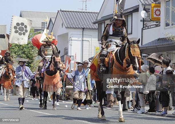 Japan - A warrior procession marches on a street in Soma, Fukushima Prefecture, on July 28 in a wild horse chase festival. The three-day Soma Nomaoi,...