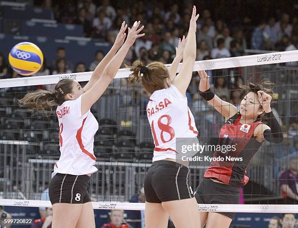 Britain - Japan's Ai Otomo spikes the ball during the second set of a match against Algeria in the women's volleyball tournament at Earls Court...