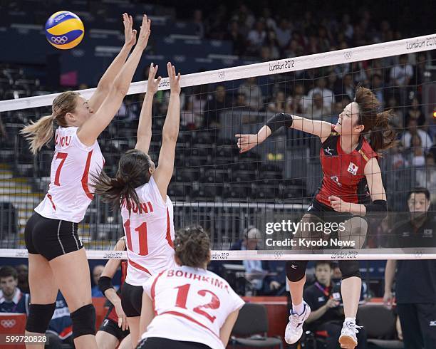 Britain - Japan's Mai Yamaguchi spikes the ball during the second set of a match against Algeria in the women's Olympic volleyball tournament at...