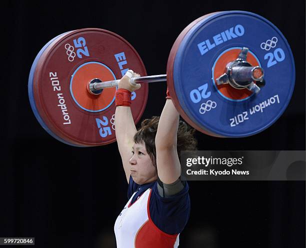 Britain - Hiromi Miyake competes in the Olympic women's weightlifting 48-kilogram class, en route to the silver medal with a total of 197 kg, at...