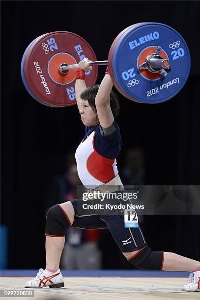 Britain - Hiromi Miyake competes in the Olympic women's weightlifting 48-kilogram class, en route to the silver medal with a total of 197 kg, at...