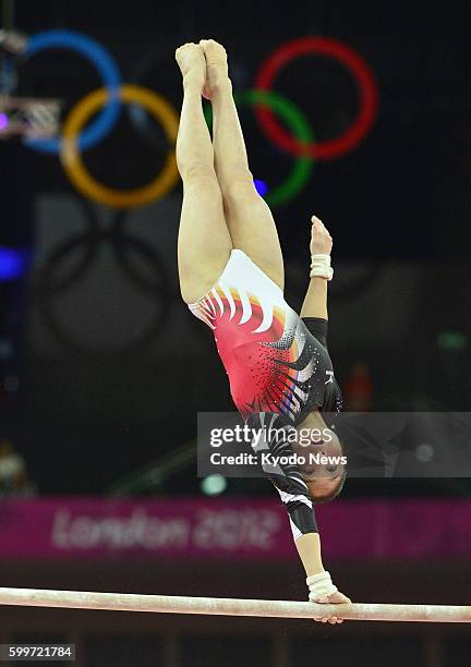 Britain - Koko Tsurumi competes on the uneven bars during the London Olympics women's gymnastics qualification round at North Greenwich Arena on July...